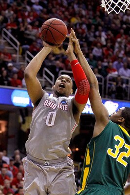 CLEVELAND, OH - MARCH 20: Jared Sullinger #0 of the Ohio State Buckeyes drives to the basket against Johnny Williams #32 of the George Mason Patriots during the third of the 2011 NCAA men's basketball tournament at Quicken Loans Arena on March 20, 2011 in