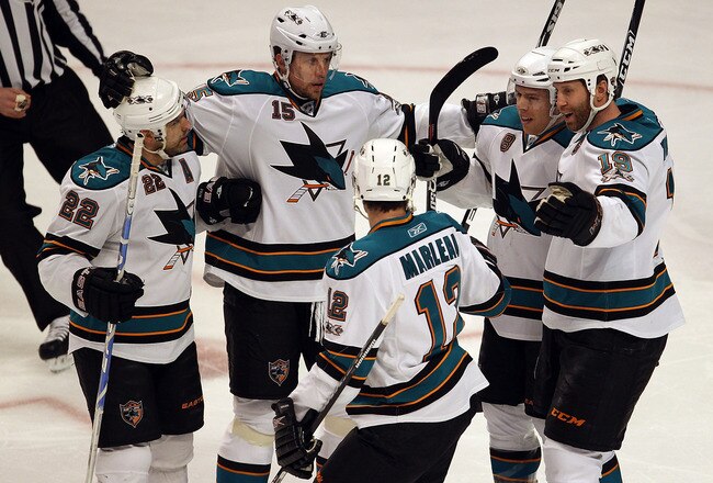CHICAGO, IL - MARCH 14: (L-R) Dan Boyle #22, Dany Heatley #15, Patrick Marleau #12, Ian White #9 and Joe Thornton #19 of the San Jose Sharks celebrate a goal against the Chicago Blackhawks at the United Center on March 14, 2011 in Chicago, Illinois. The B