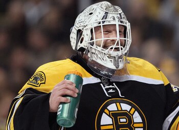 BOSTON, MA - MARCH 24:  Tim Thomas #30 of the Boston Bruins takes a drink during a stop in play in the second period against the Montreal Canadiens on March 24, 2011 at the TD Garden in Boston, Massachusetts.  (Photo by Elsa/Getty Images)