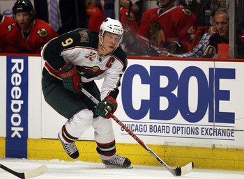 CHICAGO, IL - FEBRUARY 16: Mikko Koivu #9 of the Minnesota Wild skates up the ice against the Chicago Blackhawks at the United Center on February 16, 2011 in Chicago, Illinois. The Blackhawks defeated the Wild 3-1. (Photo by Jonathan Daniel/Getty Images)