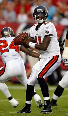 TAMPA, FL - AUGUST 28:  Quarterback Josh Johnson #11 of the Tampa Bay Buccaneers looks for an open receiver against the Jacksonville Jaguars during a preseason game at Raymond James Stadium on August 28, 2010 in Tampa, Florida.  (Photo by J. Meric/Getty I
