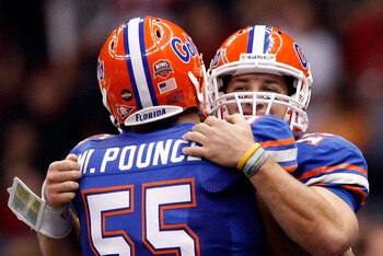 NEW ORLEANS - JANUARY 01:  Tim Tebow #15 of the Florida Gators hugs teammate Mike Pouncey #55 after scoring a touchdown against the Cincinnati Bearcats during the Allstate Sugar Bowl at the Louisana Superdome on January 1, 2010 in New Orleans, Louisiana.