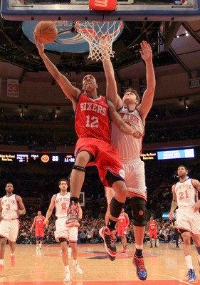 NEW YORK, NY - FEBRUARY 06:  Evan Turner #12 of the Philadelphia 76ers lays the ball up over Danilo Gallinari #12 of the New York Knicks at Madison Square Garden on February 6, 2011 in New York City. NOTE TO USER: User expressly acknowledges and agrees th