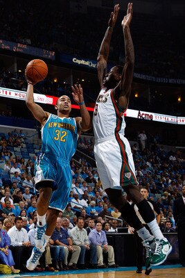 Larry Sanders trying to block a shot.