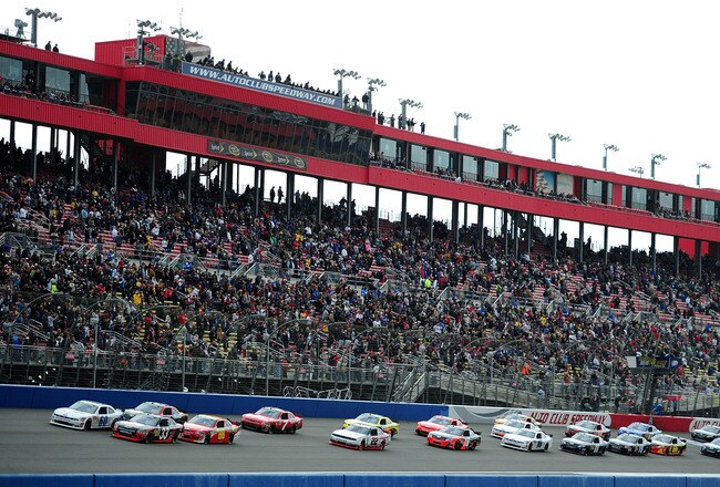 FONTANA, CA - MARCH 26:  Kevin Harvick, driver of the #33 Rheem Pool & Spa Heaters Chevrolet, and Carl Edwards, driver of the #60 Roush Fenway Racing Ford, lead the field on the first lap of the NASCAR Nationwide Series Royal Purple 300 at Auto Club Speed