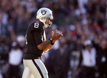 OAKLAND, CA - OCTOBER 31:  Jason Campbell #8 of the Oakland Raiders claps his hands after the Raiders scored their last touchdown against the Seattle Seahawks at Oakland-Alameda County Coliseum on October 31, 2010 in Oakland, California.  (Photo by Ezra S