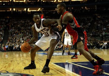 Damion James posts up Sonny Weems.