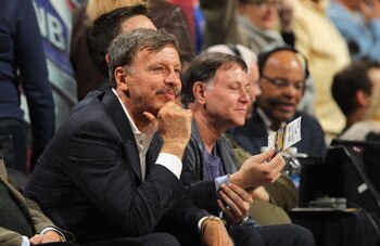 Stan Kroenke, owner of the Denver Nuggets, watching a game.
