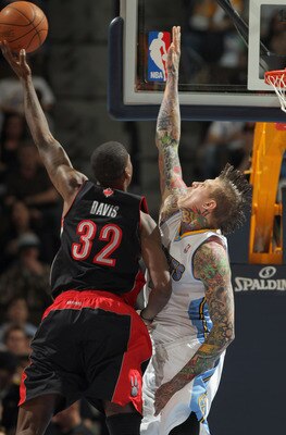 Ed Davis shoots past Chris Andersen.