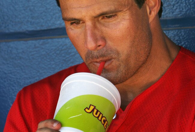 LONG BEACH, CA - JULY 16:  Jose Canseco #33 of the Long Beach Armada drinks a juice drink while resting in between Golden Baseball League games against the Fullerton Flyers on July 16, 2006 at Blair Field in Long Beach, California.  (Photo By Christian Pe