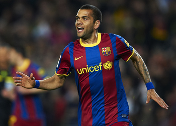 BARCELONA, SPAIN - MARCH 19:  Daniel Alves of Barcelona celebrates after scoring during the La Liga match between Barcelona and Getafe at Camp Nou on March 19, 2011 in Barcelona, Spain. Barcelona won 2-1. (Photo by Manuel Queimadelos Alonso/Getty Images)