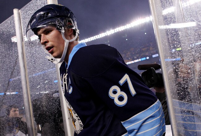 PITTSBURGH, PA - JANUARY 01:  Sidney Crosby #87 of the Pittsburgh Penguins walks off the ice after being defeated 3-1 by the Washington Capitals during the 2011 NHL Bridgestone Winter Classic at Heinz Field on January 1, 2011 in Pittsburgh, Pennsylvania.