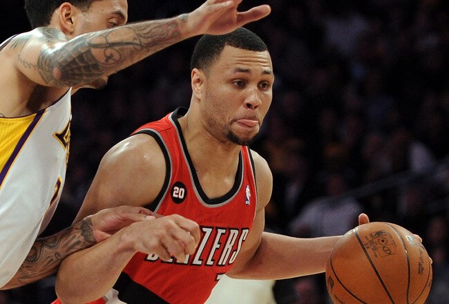 LOS ANGELES, CA - MARCH 20:  Brandon Roy #7 of the Portland Trail Blazers dribbles as he is defended by Matt Barnes #9 of the Los Angeles Lakers at the Staples Center on March 20, 2011 in Los Angeles, California.  NOTE TO USER: User expressly acknowledges