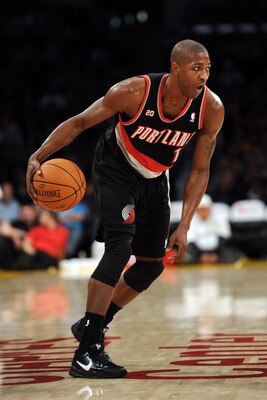 Armon Johnson dribbles the basketball.