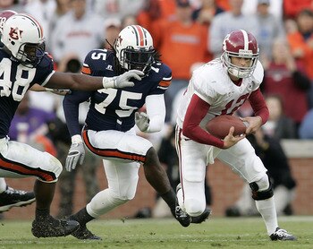 AUBURN, AL - NOVEMBER 19:  Quarterback Brodie Croyle #12 of the University of Alabama is chased by Marquies Gunn #48 and Stanley McClover #75 of Auburn University on November 19, 2005 at Jordan-Hare Stadium in Auburn, Alabama.   (Photo by Chris Graythen/G