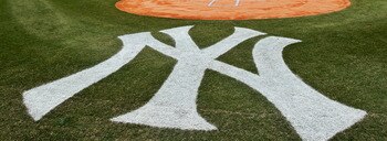 NEW YORK, NY - MARCH 31:  The New York Yankees and the Detroit Tigers look on as West Point Cadets unfurl the American Flag during the opening ceremonies on Opening Day at Yankee Stadium on March 31, 2011 in Bronx borough of New York City.  (Photo by Nick