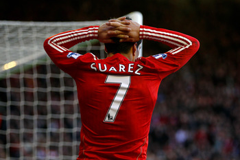 LIVERPOOL, ENGLAND - FEBRUARY 12: Luis Suarez of Liverpool reacts to a missed chance during the Barclays Premier League match between Liverpool and Wigan Athletic at Anfield on February 12, 2011 in Liverpool, England. (Photo by Clive Brunskill/Getty Ima