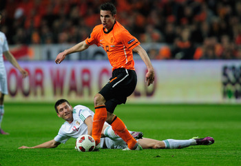 AMSTERDAM, NETHERLANDS - MARCH 29: Robin Van Persie of the Netherlands battles with Adam Pinter of Hungary during the Group E, EURO 2012 Qualifier between Netherlands and Hungary at the Amsterdam Arena on March 29, 2011 in Amsterdam, Netherlands. (Photo