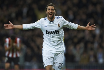 MADRID, SPAIN - NOVEMBER 20: Gonzalo Higuain of Real Madrid celebrates after scoring the 1-0 during the la liga match between Real Madrid and Athletic Bilbao at Estadio Santiago Bernabeu on November 20, 2010 in Madrid, Spain. (Photo by Manuel Queimadelo