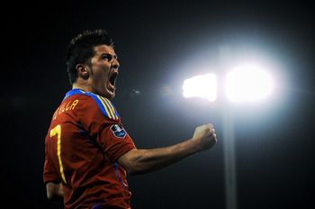 GRANADA, SPAIN - MARCH 25: David Villa of Spain (R) celebrates after scoring his second goal during the UEFA EURO 2012 qualifier between Spain and Czech Republic at Los Carmenes Stadium on March 25, 2011 in Granada, Spain. Spain win 2-1. (Photo by David