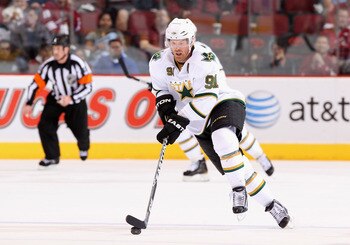 GLENDALE, AZ - MARCH 29:  Brad Richards #91 of the Dallas Stars skates with the puck during the NHL game against the Phoenix Coyotes at Jobing.com Arena on March 29, 2011 in Glendale, Arizona. The Coyotes defeated the Stars 2-1 in an overtime shoot out.