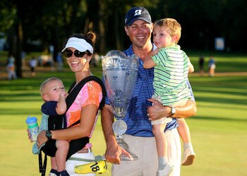 PARAMUS, NJ - AUGUST 29:  Matt Kuchar celebrates with his wife Sybi and sons Cameron (R) and Carson after he made his putt on the 18th green during a 1 hole playoff to win The Barclays at the Ridgewood Country Club on August 29, 2010 in Paramus, New Jerse