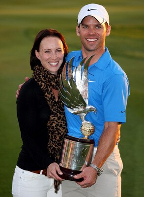 ABU DHABI, UNITED ARAB EMIRATES - JANUARY 18:  Recently-married Paul Casey of England and his wife Jocelyn pose with the trophy after winning The Abu Dhabi Golf Championship at Abu Dhabi Golf Club on January 18, 2009 in Abu Dhabi, United Arab Emirates.  (