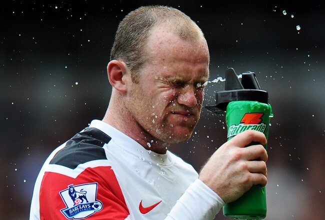 LONDON, ENGLAND - APRIL 02:  Wayne Rooney of Manchester United feels the heat during the Barclays Premier League match between West Ham United and Manchester United at the Boleyn Ground on April 2, 2011 in London, England.  (Photo by Mike Hewitt/Getty Ima
