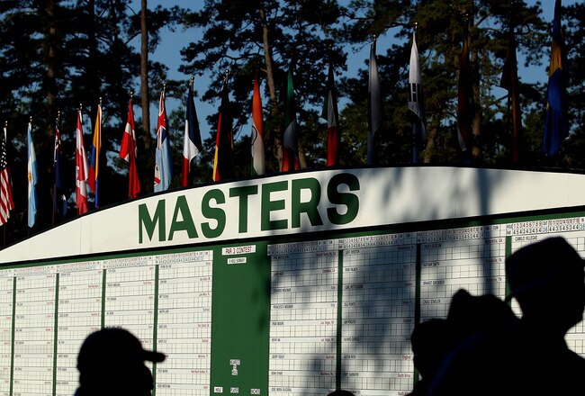AUGUSTA, GA - APRIL 04:  Patrons pass before a Masters leaderboard during a practice round prior to the 2011 Masters Tournament at Augusta National Golf Club on April 4, 2011 in Augusta, Georgia.  (Photo by Andrew Redington/Getty Images)
