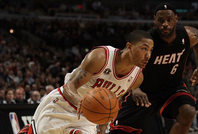 CHICAGO, IL - FEBRUARY 24: Derrick Rose #1 of the Chicago Bulls drives past LeBron James #6 of the Miami Heat at the United Center on February 24, 2011 in Chicago, Illinois. The Bulls defeated the Heat 93-89. NOTE TO USER: User expressly acknowledges and