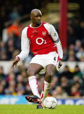 LONDON - DECEMBER 26:  Patrick Vieira of Arsenal passes the ball during the FA Barclaycard Premiership match between Arsenal and Wolverhampton Wanderers at Highbury on December 26, 2003 in London, England.  Arsenal won the match 3-0. (Photo by Clive Mason