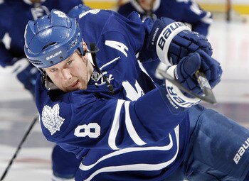 TORONTO, CANADA - MARCH 2:  Mike Komisarek #8 of the Toronto Maple Leafs shoots during warm-up before game action against the Pittsburgh Penguins at the Air Canada Centre March 2, 2011 in Toronto, Ontario, Canada. (Photo by Abelimages/Getty Images)