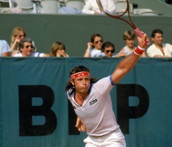 PARIS - 1982:  Guillermo Vilas of Argentina follows through on his backhand during a match in the 1982 French Open at the Stade Roland Garros in Paris, France.  (Photo by Steve Powell/Getty Images)