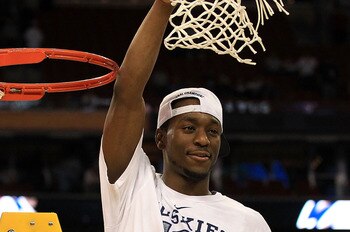 HOUSTON, TX - APRIL 04:  Kemba Walker #15 of the Connecticut Huskies cuts down the net after defeating the Butler Bulldogs to win the National Championship Game of the 2011 NCAA Division I Men's Basketball Tournament by a score of 53-41 at Reliant Stadium