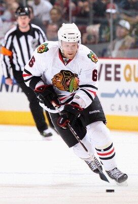 GLENDALE, AZ - FEBRUARY 12:  Jordan Hendry #6 of the Chicago Blackhawks skates with the puck during the NHL game against the Phoenix Coyotes at Jobing.com Arena on February 12, 2011 in Glendale, Arizona.  The Coyotes defeated the Blackhawks 3-2 in an over