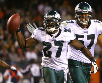 CHICAGO - SEPTEMBER 28: (L-R) Quintin Mikell #27 and Chris Gocong #57 of the Philadelphia Eagles celebrate after Mikell intercepted a pass in the third quarter against the Chicago Bears at Soldier Field on September 28, 2008 in Chicago, Illinois. (Photo