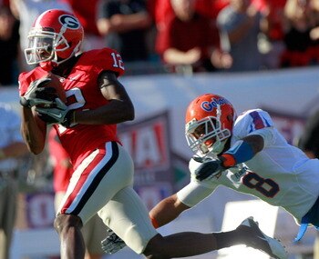JACKSONVILLE, FL - OCTOBER 30:  Jeremy Brown #8 of the Florida Gators attempts to tackle Tavarres King #12 of the Georgia Bulldogs during the game at EverBank Field on October 30, 2010 in Jacksonville, Florida.  (Photo by Sam Greenwood/Getty Images)