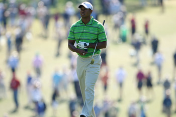 AUGUSTA, GA - APRIL 07:  Tiger Woods walks up the first hole during the first round of the 2011 Masters Tournament at Augusta National Golf Club on April 7, 2011 in Augusta, Georgia.  (Photo by Andrew Redington/Getty Images)