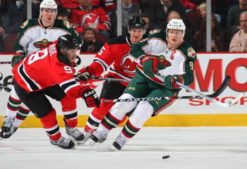 NEWARK, NJ - MARCH 20: Mikko Koivu #9 of the Minnesota Wild skates against Zach Parise #9 of the New Jersey Devils on March 20, 2009 at the Prudential Center in Newark, New Jersey. (Photo by Bruce Bennett/Getty Images)