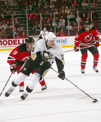 NEWARK - JANUARY 29: Evgeni Malkin #71 of the Pittsburgh Penguins skates against Zach Parise #9 of the New Jersey Devils on January 29, 2008 at the Prudential Center in Newark, New Jersey. (Photo by: Bruce Bennett/Getty Images)
