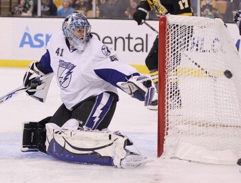 BOSTON, MA - MARCH 03:  Mike Smith #41 of the Tampa Bay Lightning stops a shot by the Boston Bruins in the first period on March 3, 2011 at the TD Garden in Boston, Massachusetts.  (Photo by Elsa/Getty Images)