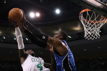 BOSTON - MAY 28:  Nate Robinson #4 of the Boston Celtics has his shot attempt blocked by Dwight Howard #12 of the Orlando Magic in Game Six of the Eastern Conference Finals during the 2010 NBA Playoffs at TD Garden on May 28, 2010 in Boston, Massachusetts