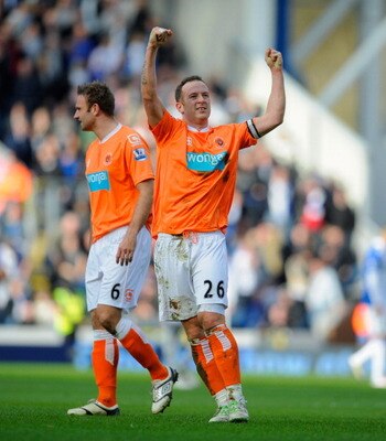 BLACKBURN, ENGLAND - MARCH 19: Charlie Adam of Blackpool celebrates after scoring to make it 1-0 during the Barclays Premier League match between Blackburn Rovers and Blackpool at Ewood Park on March 19, 2011 in Blackburn, England. (Photo by Michael Reg