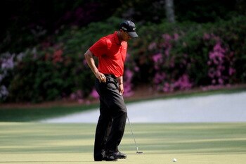 AUGUSTA, GA - APRIL 10:  Tiger Woods reacts to a missed putt on the 13th green during the final round of the 2011 Masters Tournament at Augusta National Golf Club on April 10, 2011 in Augusta, Georgia.  (Photo by Harry How/Getty Images)
