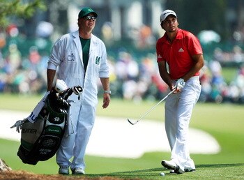 AUGUSTA, GA - APRIL 10:  Jason Day of Australia chats with his caddie Colin Swatton on the first hole during the final round of the 2011 Masters Tournament at Augusta National Golf Club on April 10, 2011 in Augusta, Georgia.  (Photo by Jamie Squire/Getty