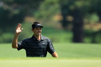 AUGUSTA, GA - APRIL 10:  Charl Schwartzel of South Africa waves to the gallery after holing a shot for eagle on the third green during the final round of the 2011 Masters Tournament on April 10, 2011 in Augusta, Georgia.  (Photo by David Cannon/Getty Imag