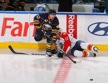 BUFFALO, NY - MARCH 25: Nathan Gerbe #42  of the Buffalo Sabres makes a pass after avoiding Niclas Bergfors #11 of the Florida Panthers at HSBC Arena on March 25, 2011 in Buffalo, New York.  (Photo by Rick Stewart/Getty Images)