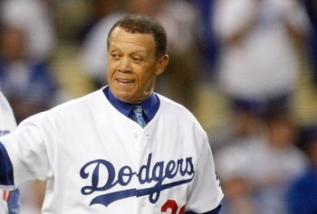 LOS ANGELES, CA - OCTOBER 07:  (R-L) Former Los Angeles Dodgers Maury Wills and Tommy Davis throw out the first pitch before the Dodgers take on the St. Louis Cardinals in Game One of the NLDS during the 2009 MLB Playoffs at Dodger Stadium on October 7, 2