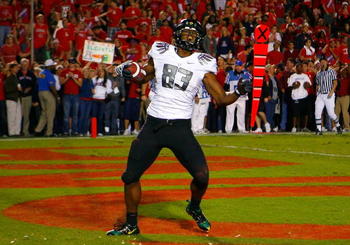 TUCSON, AZ - NOVEMBER 21:  Tight end Ed Dickson #83 of the Oregon Ducks celebrates after scoring the game tying touchdown against the Arizona Wildcats during the final moments of regulation in the college football game at Arizona Stadium on November 21, 2