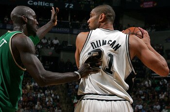 SAN ANTONIO - MARCH 17:  Forward Tim Duncan #21 of the San Antonio Spurs moves the ball against Kevin Garnett #5 of the Boston Celtics at AT&T Center March 17, 2008 in San Antonio, Texas.  NOTE TO USER: User expressly acknowledges and agrees that, by down